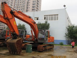 ZX330-3与ZL10014号车 日立二手挖掘机精品展示——辽宁恒力集团，重现挖土机经典工艺
